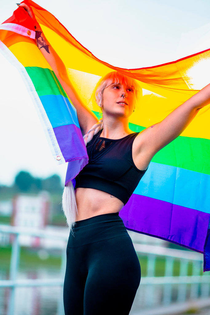 Young woman with a rainbow flag