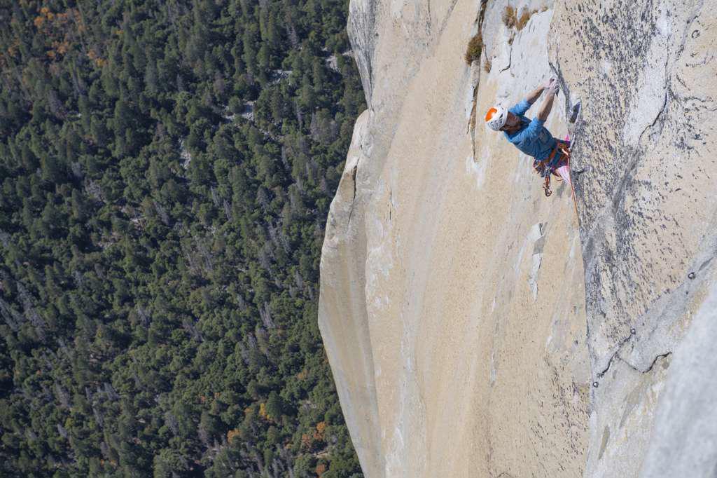 Rock climbing pulling through roof on top of The Nose El capitan