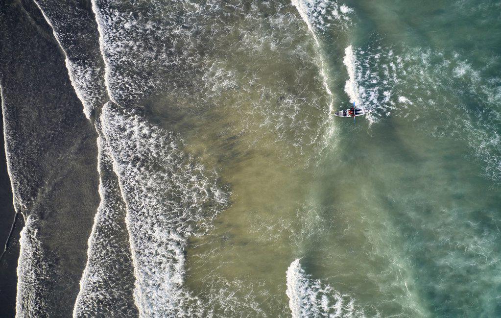 Majestic waves and kayak from drone