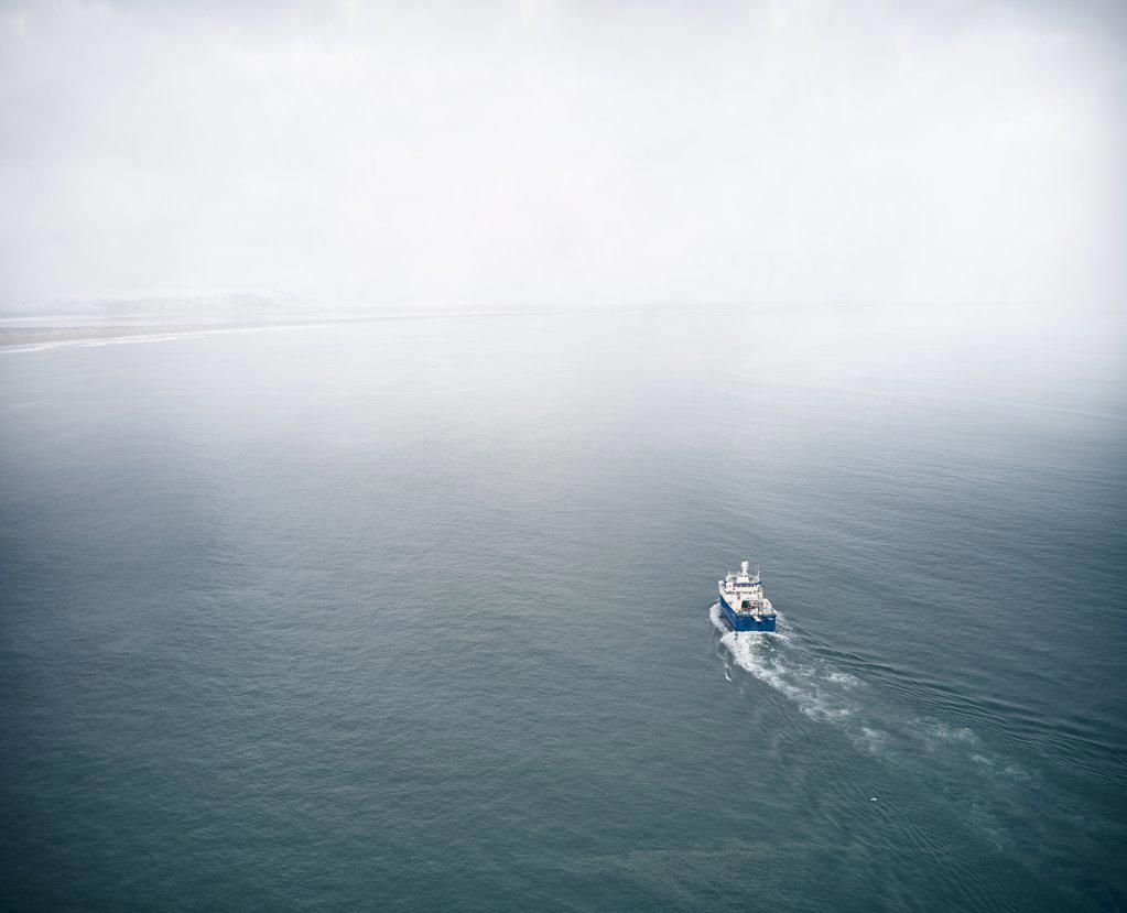 Sailboat in blue water of ocean