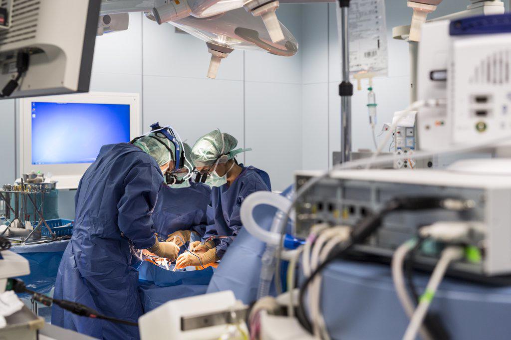 two cardiac surgeons operate on a patient