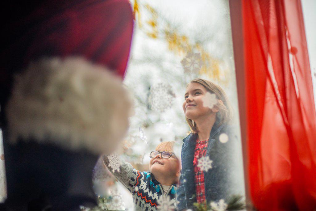 Children connect with Santa through window
