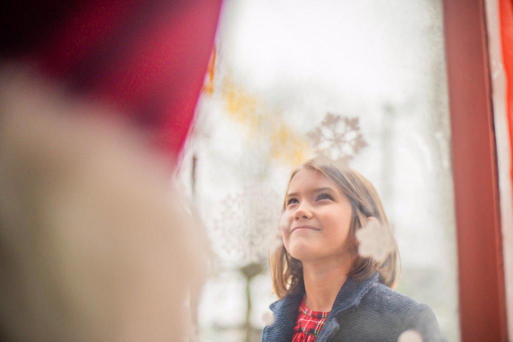 Young girl see Santa in the Window