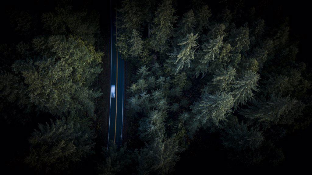 Aerial View of car motion blur through road in Pacific Northwest