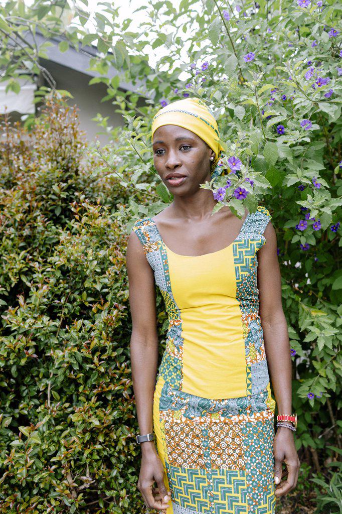 Colorful portrait serious woman wearing african bandana