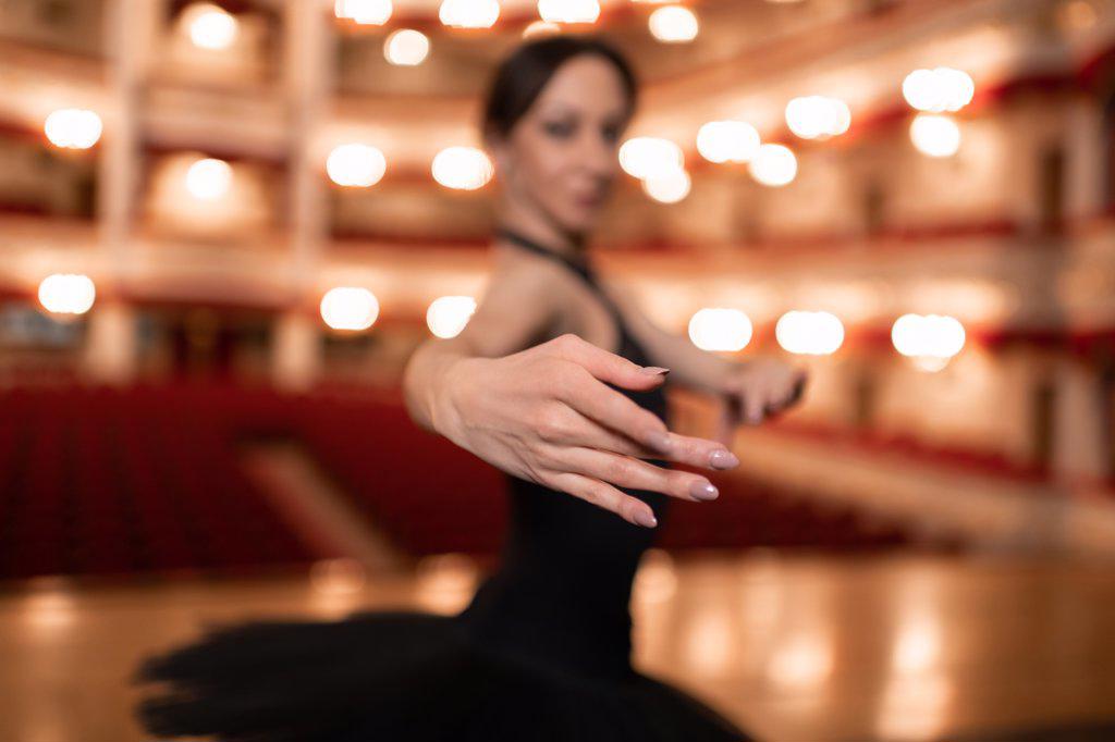 Ballerina during performance in empty theater