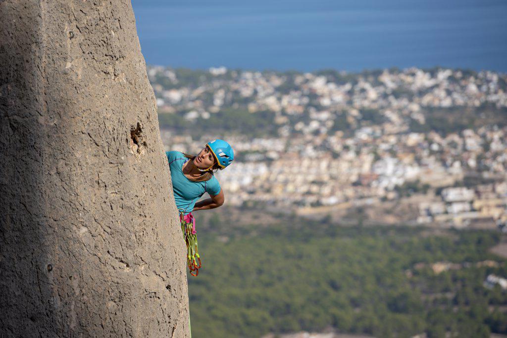 Female rock climber in  Olta mountain, Calpe, Costa Blanca, Alicante Province, Spain