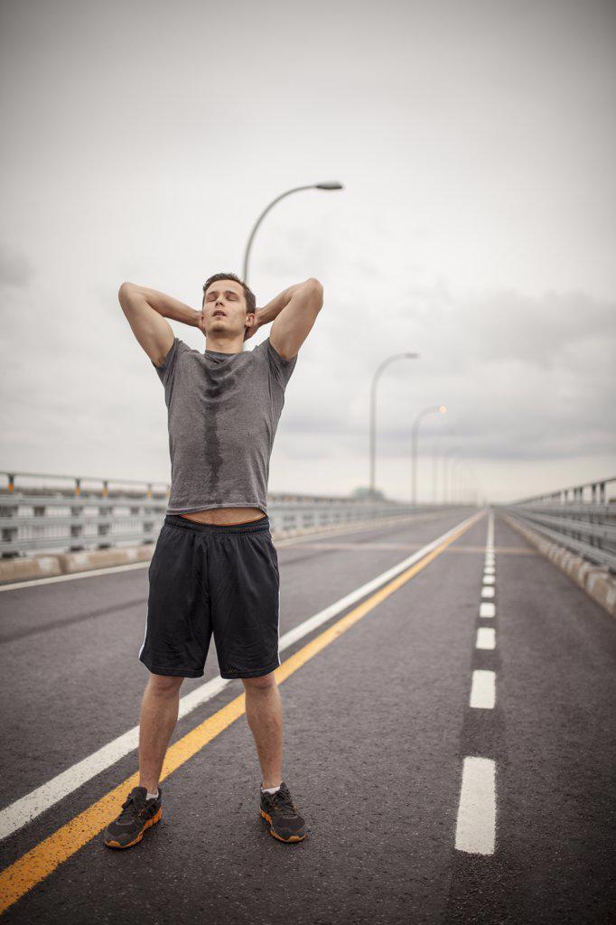 Male athlete exhausted and sweating during daily run