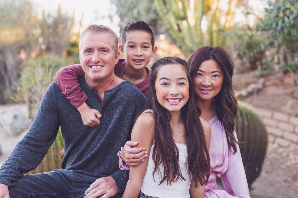 Asian and white mixed family - mother, father, son and daughter.