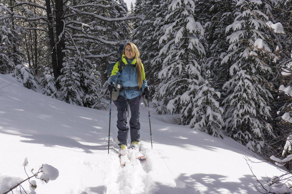Young female ski touring in high mountains of Colorado