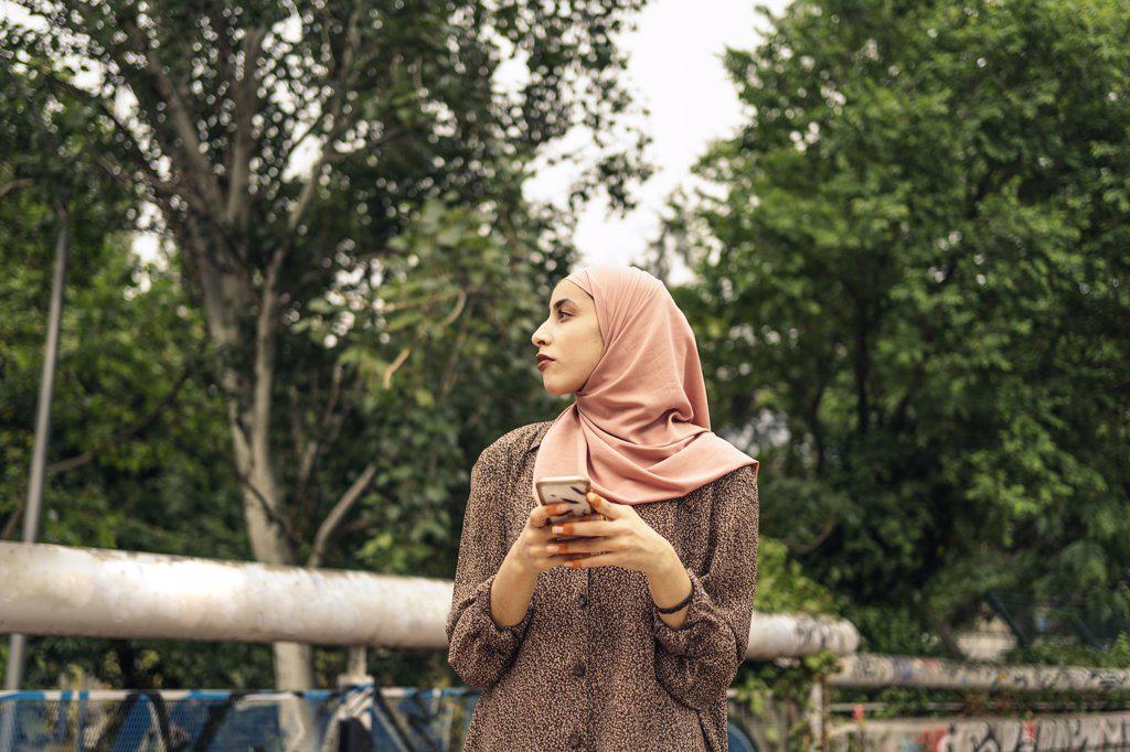muslim woman using a phone