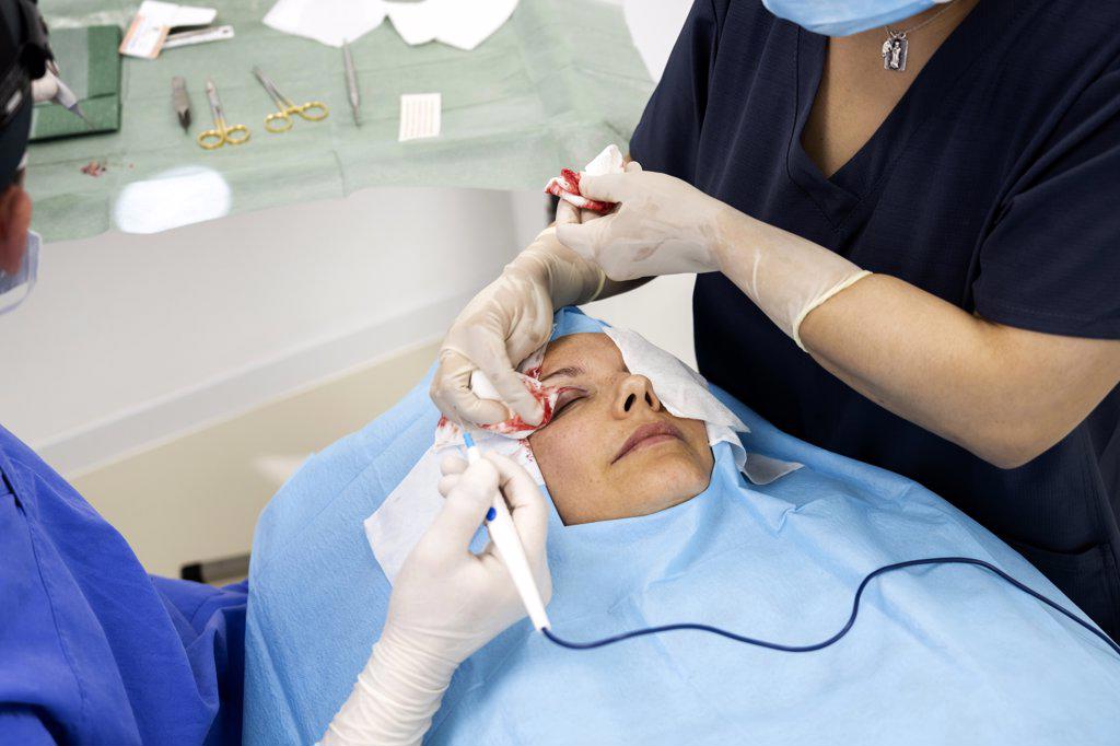 Plastic surgery operation, modifying the eye region in medical clinic