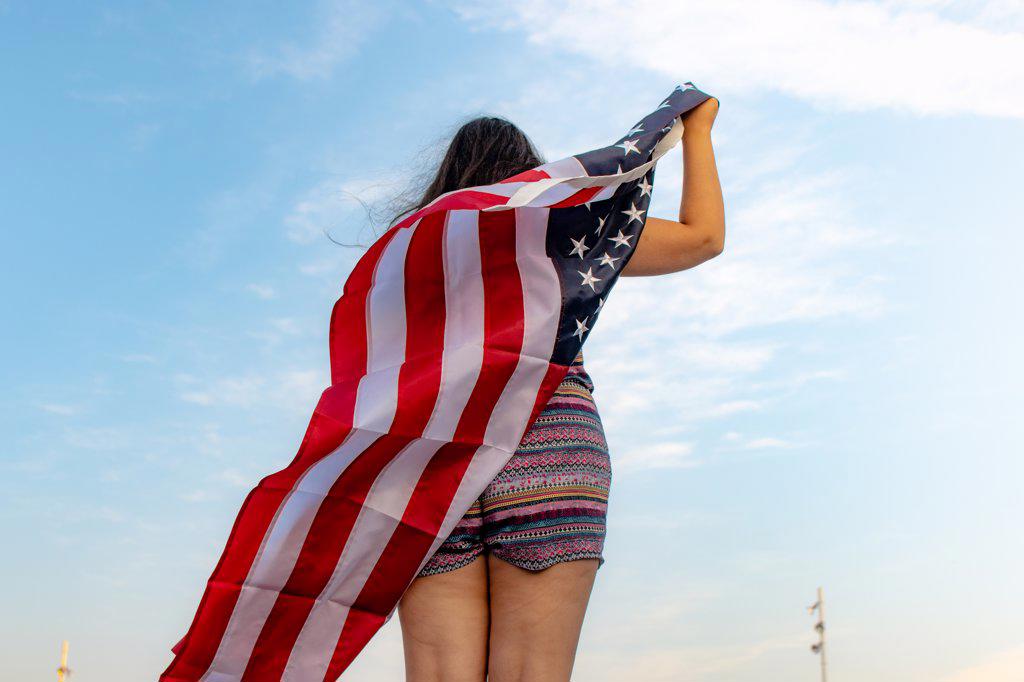 Rear view of woman with american flag