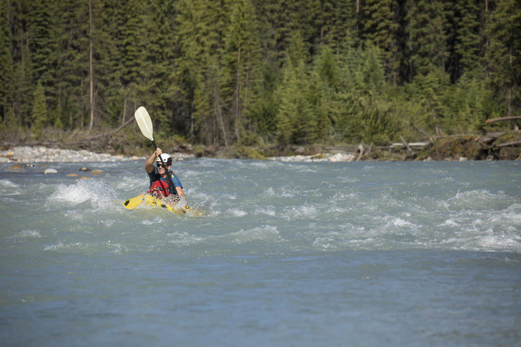 Paddler tackles rapids on the Kootney River, B.C.