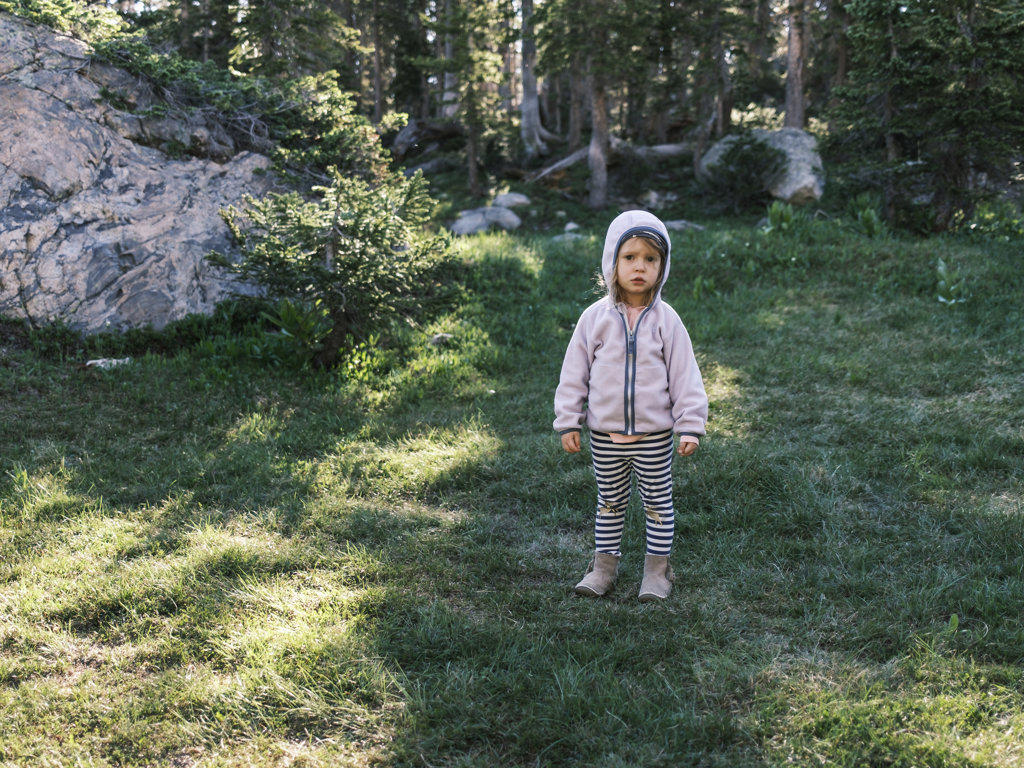 Girl standing in a forest, Colorado
