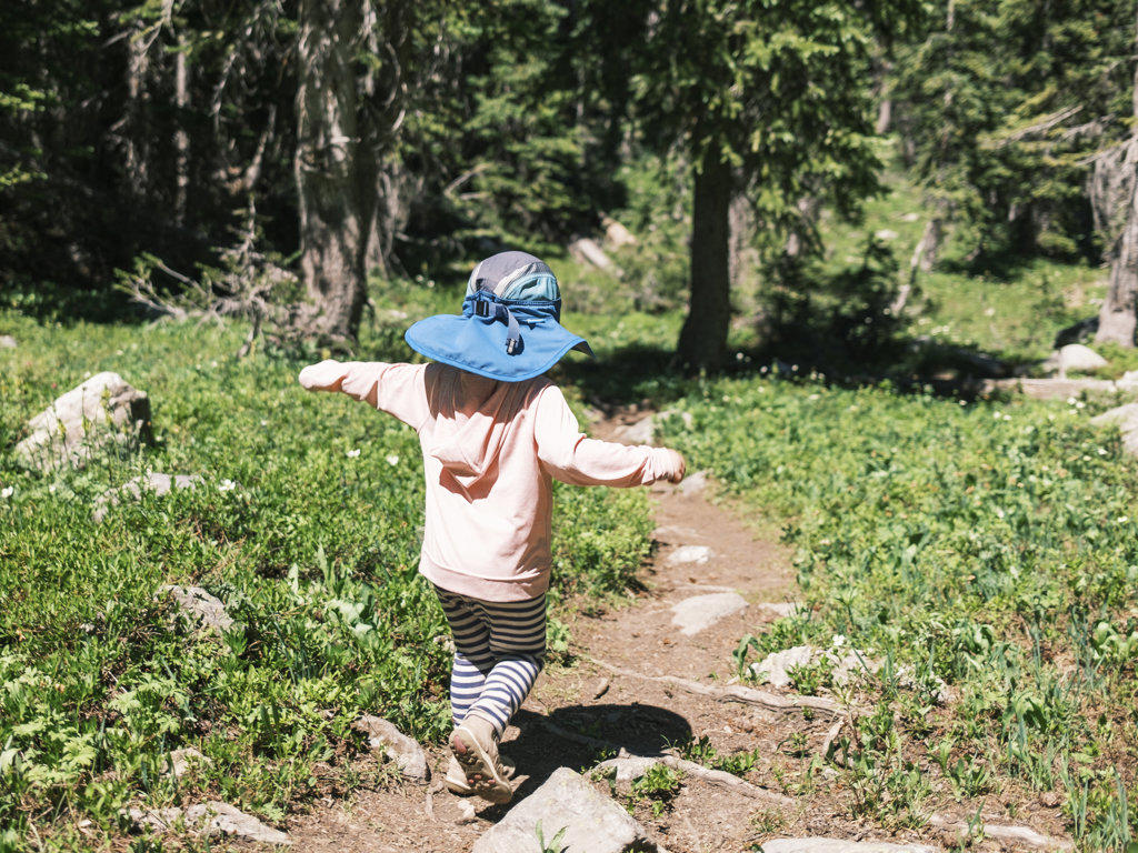 Young girl hiking down a trail, Colorado