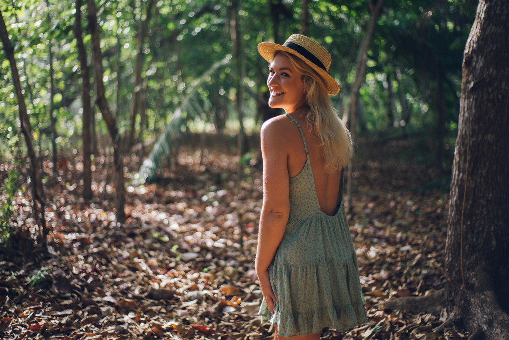 beauty portrait of a blond girl in the jungle