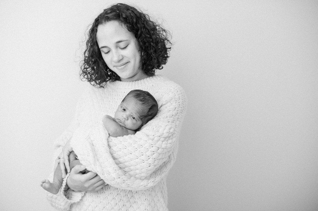 Black and White portrait of a Mother holding her newborn baby