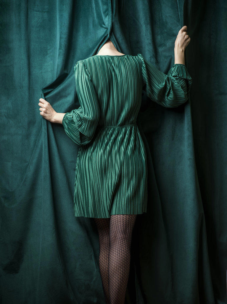 Girl in green with no visible face