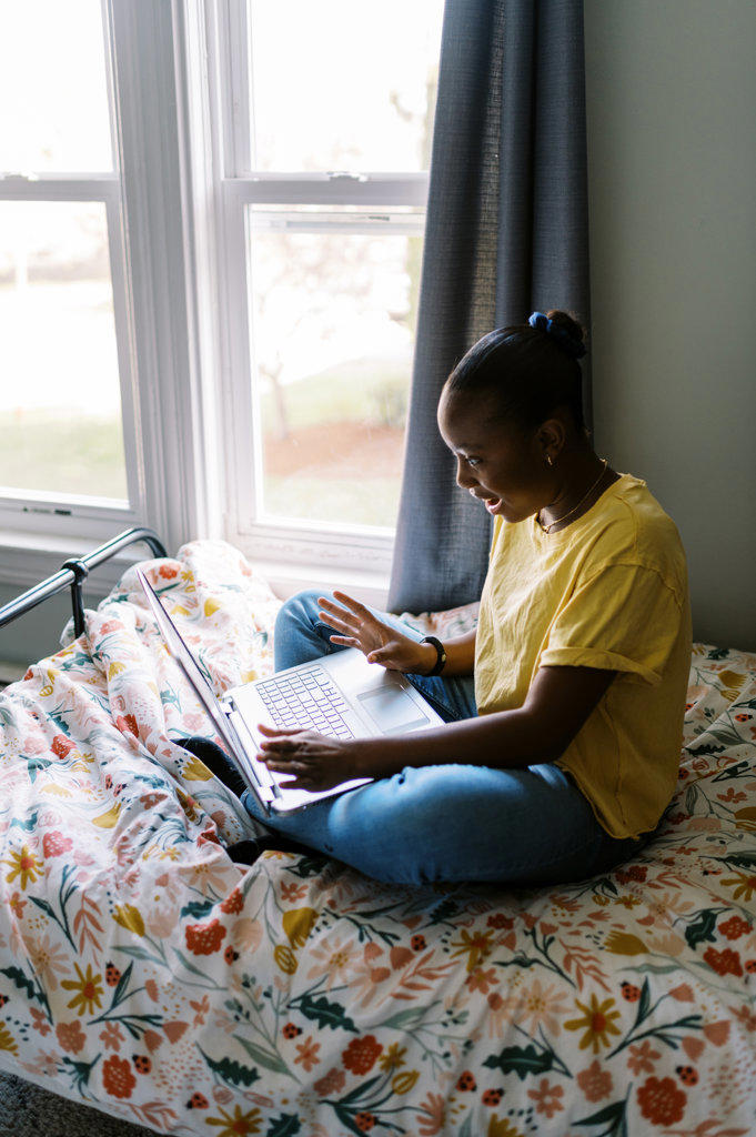 teenage black girl participating in remote class