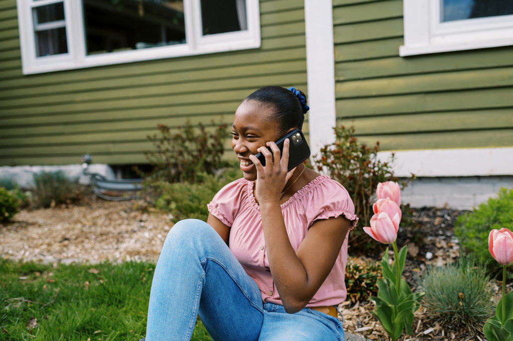 Teenage girl talking while on a phone call