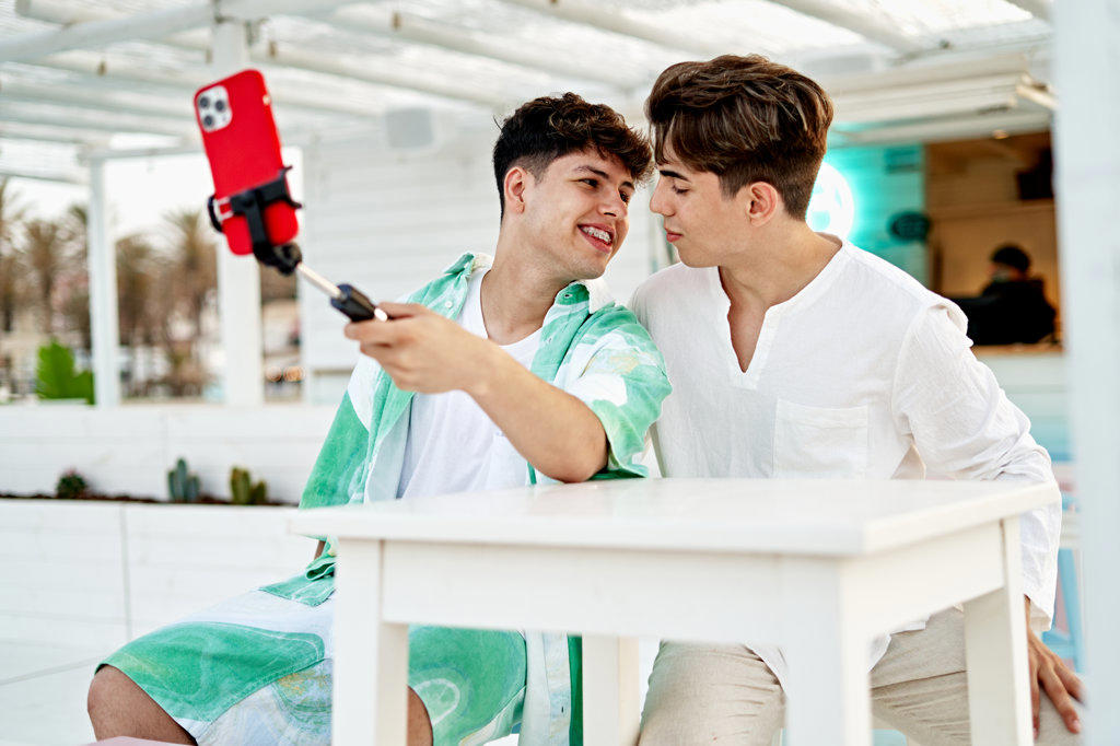 Young Gay Couple Live Streaming Themselves Using Phone