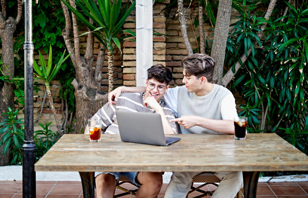 Young Gay Couple making a video call on the laptop