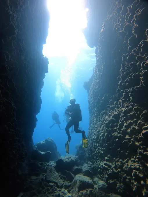 Scuba diver in entrance of cave.Kas Antalya Turkey