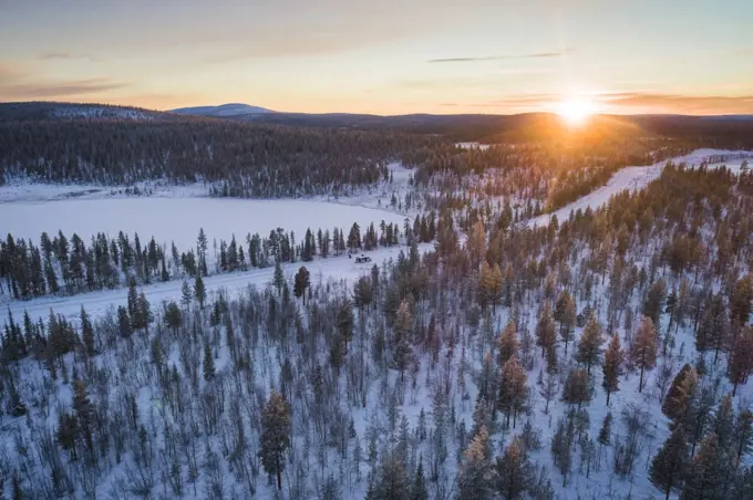snow covered nordic pine forest from aerial point of view