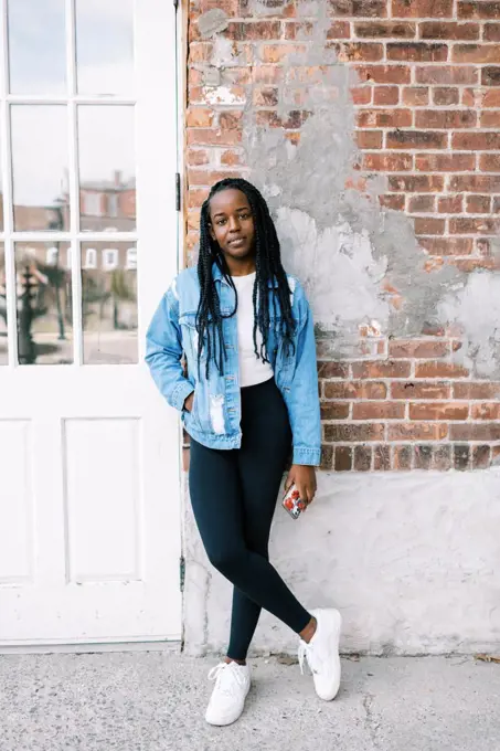 portrait headshot of beautiful young black woman in jean jacket