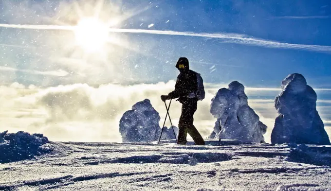 Man ski touring on a sunny day near Whistler, B.C., Canada.