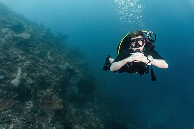 diver floating and exploring the ocean at Raja Ampat
