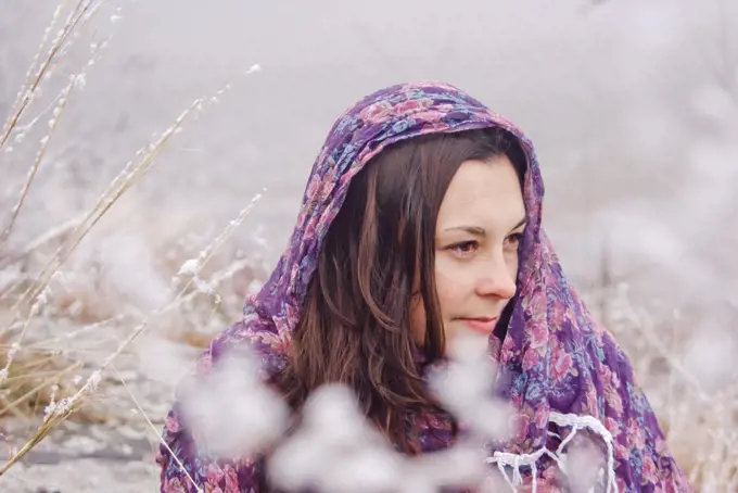 portrait of a beautiful woman on a background of snow