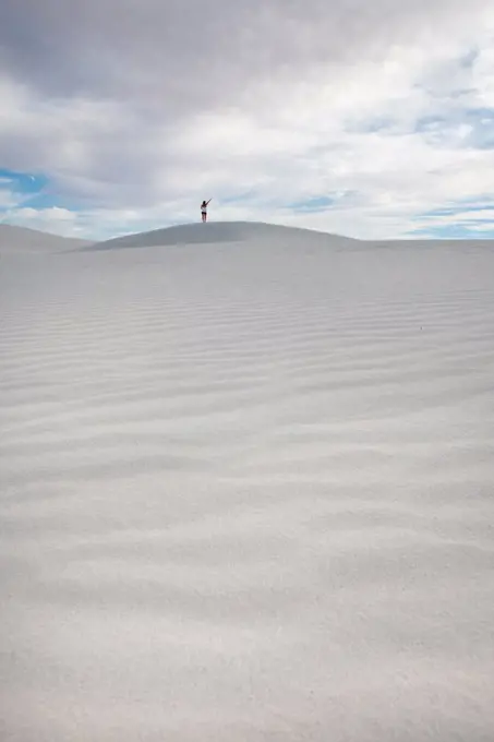 Girl On Top Of Huge Sand Dune In White Sands National Park, New Mexico