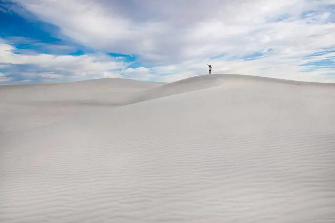 Girl On Top Of Pristine Sand Dune In White Sands New Mexico