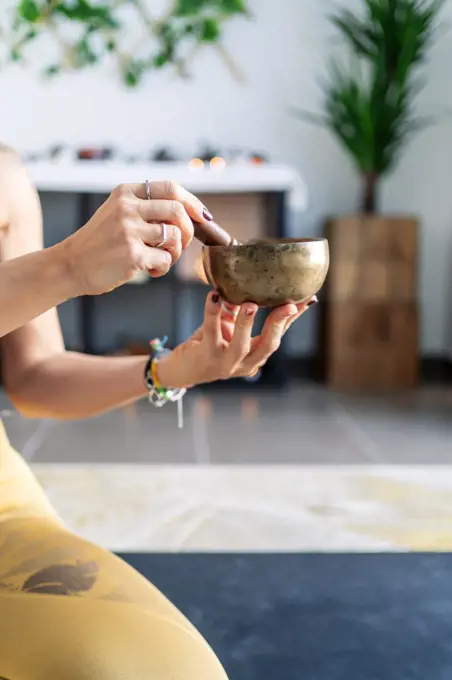 sporty woman touching her yoga vase