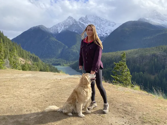 Female posing with dog above Diablo Lake in The North Cascades