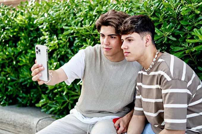 A young gay couple taking a selfie