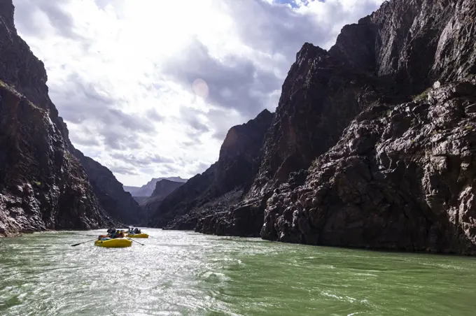 Rafts rowing through the Grand Canyon