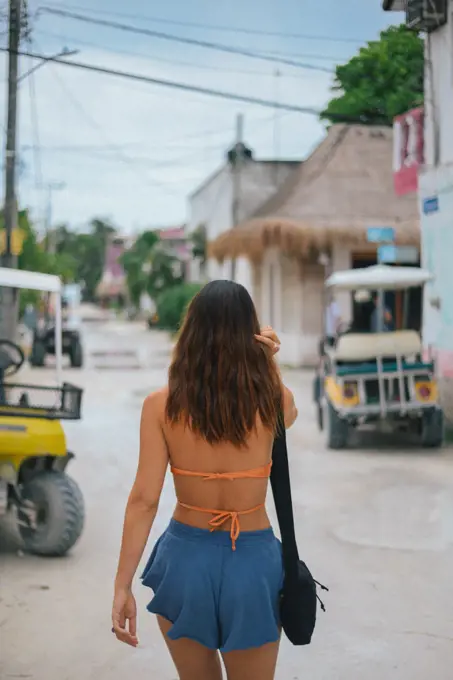 girl walking on the little town streets