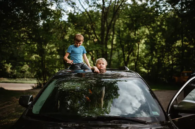 Kids playing in car at home