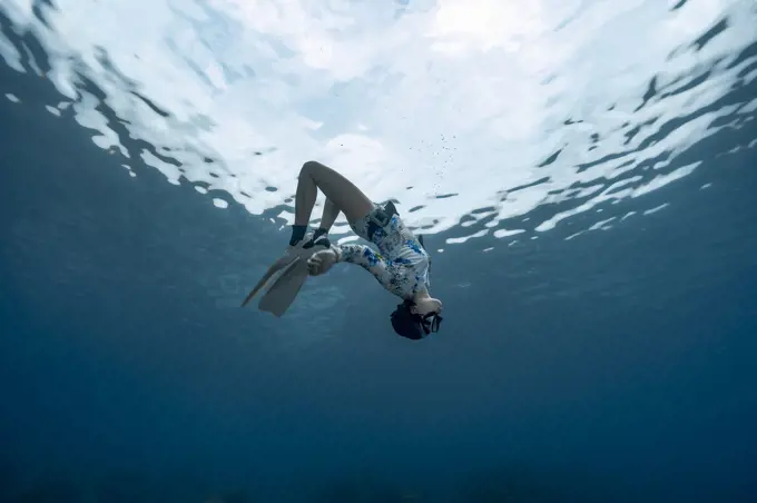 Freediver in the clear waters of the Andaman Sea in Thailand