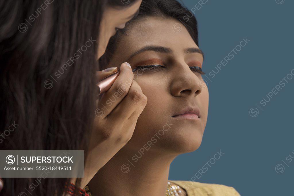 Makeup Artist Putting Eyeliner On The