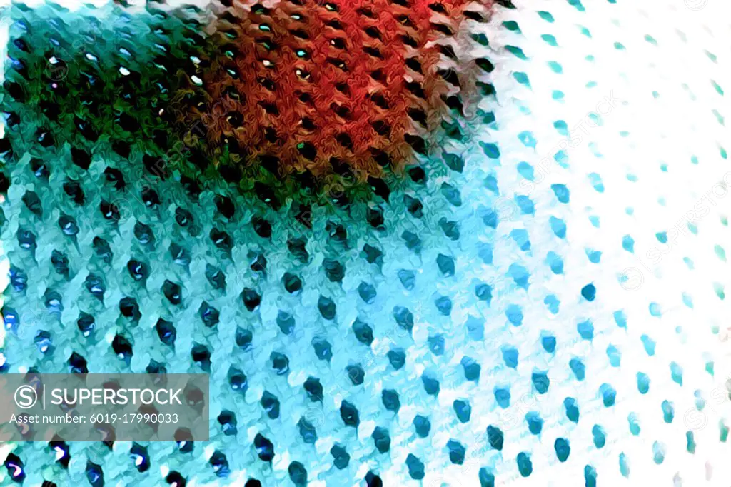 Macro shot of a mesh-like wavy red bright blue surface with holes