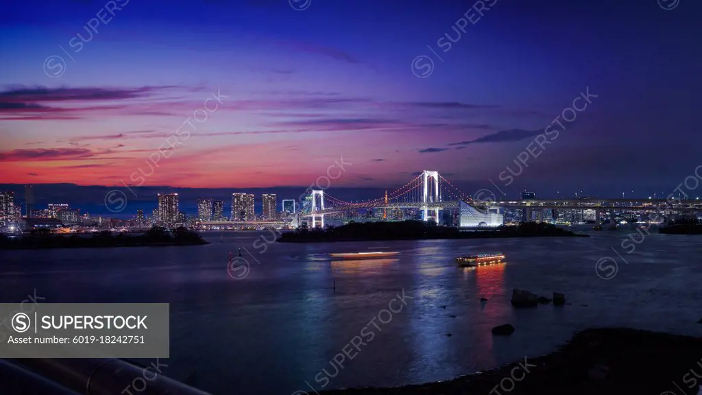 rainbow bridge of odaiba tokyo japan with cityscape in sunset sk