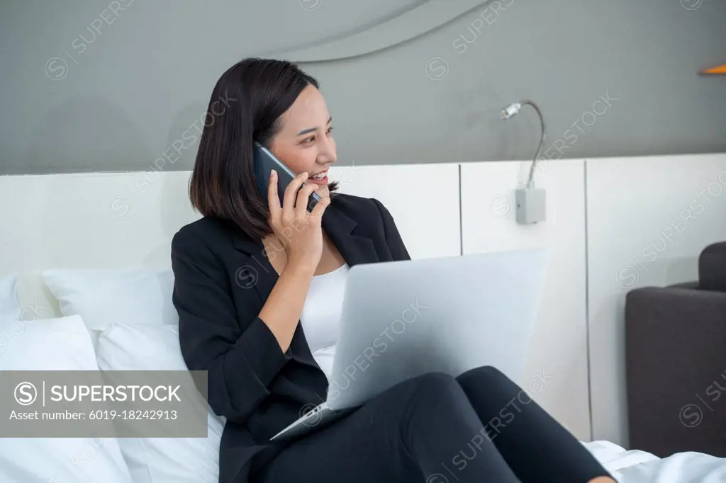 Woman working in hotel room,Business woman in suit working