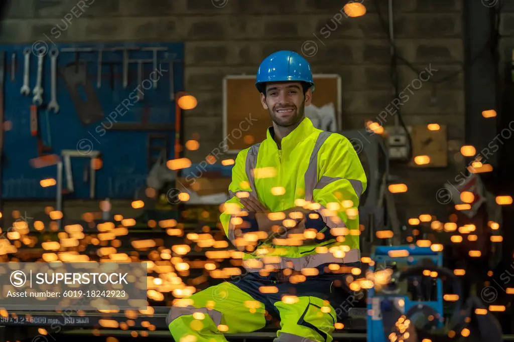 Portrait male worker welder in factory,Craftsman,sparks, labor