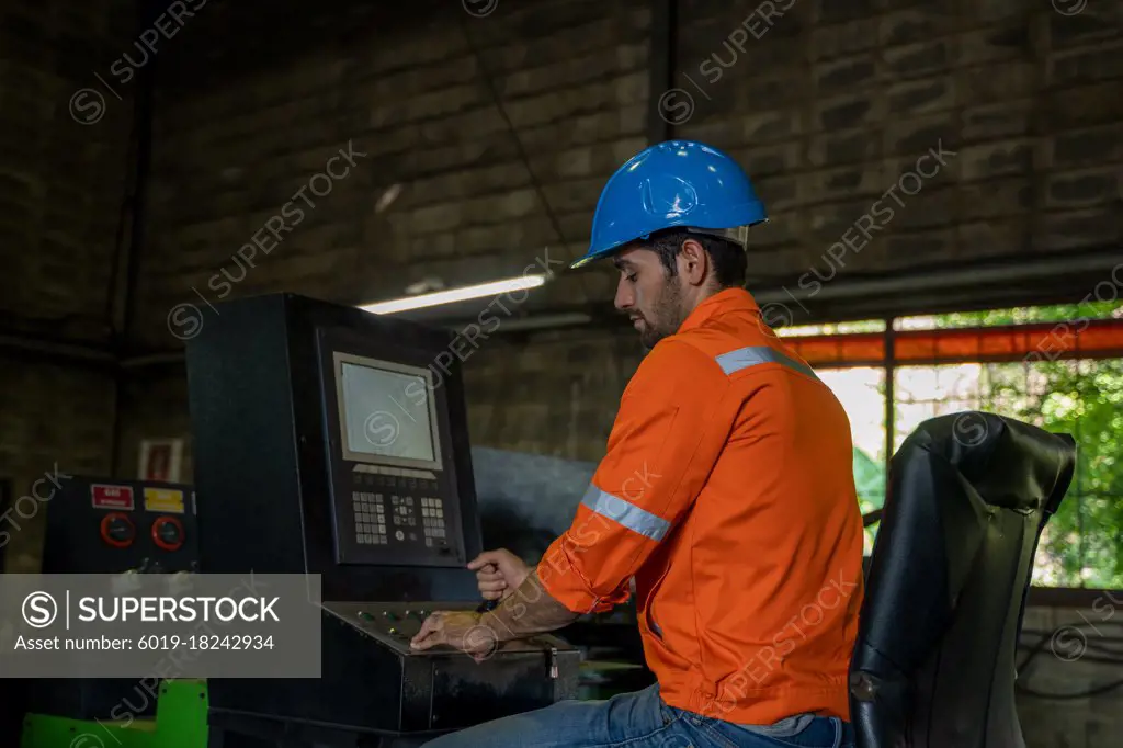 Industrial workers are working in factory.
