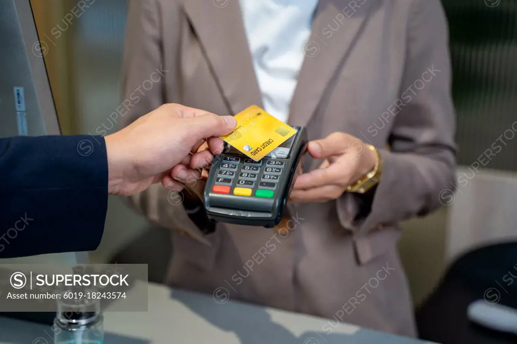 Close up of card payment being made between customer