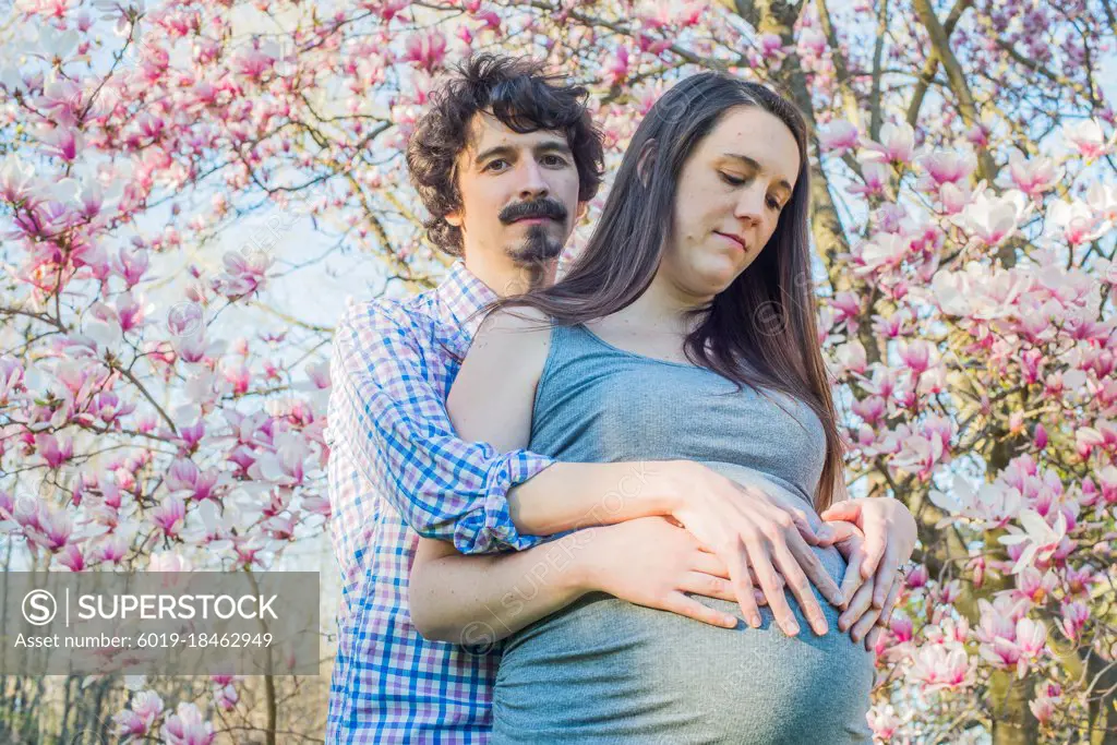 Pregnancy Portrait in the Park during cherry blossoms
